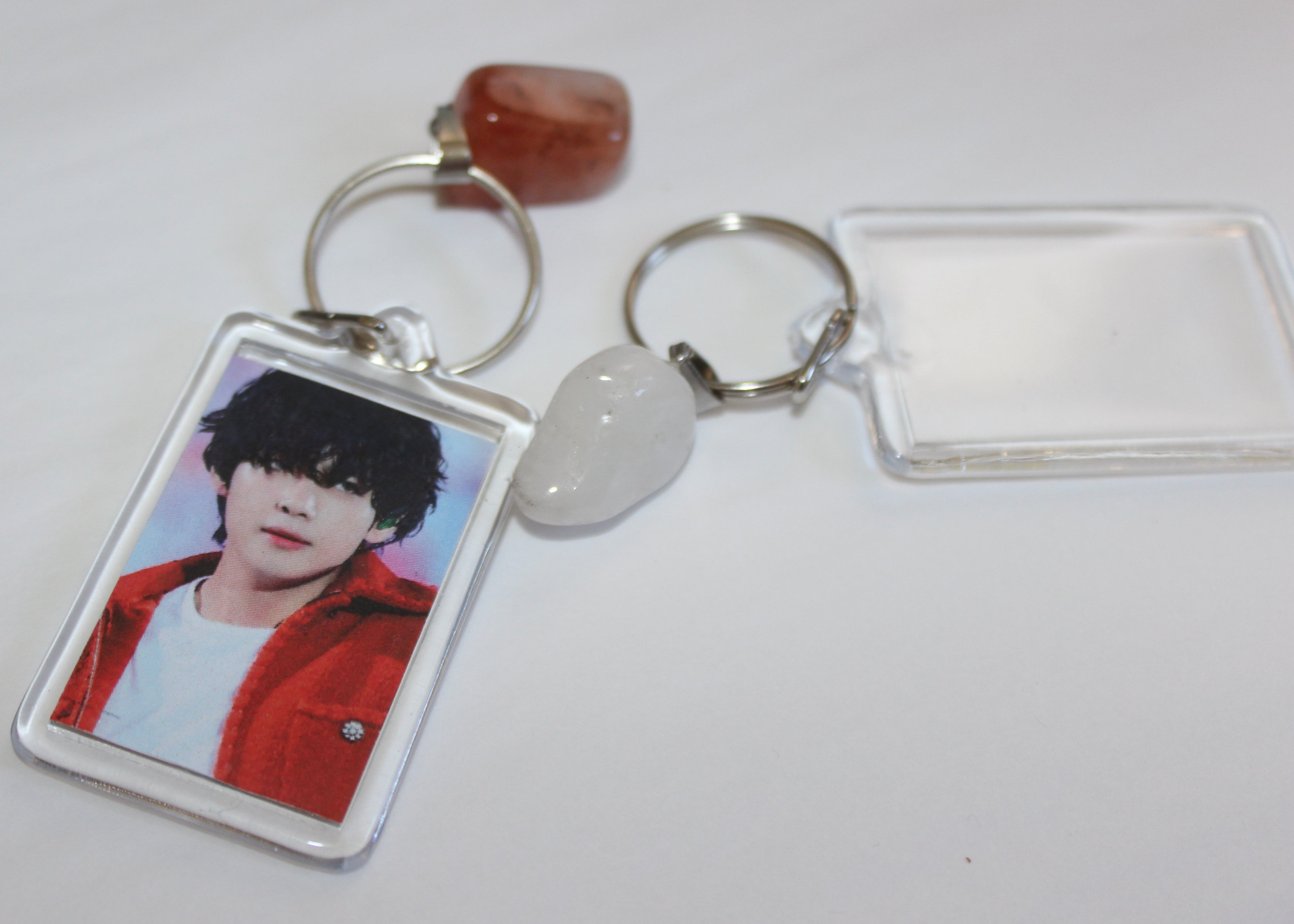 Crystal purse charm keychain featuring healing gemstones like rose quartz and amethyst for well-being.
