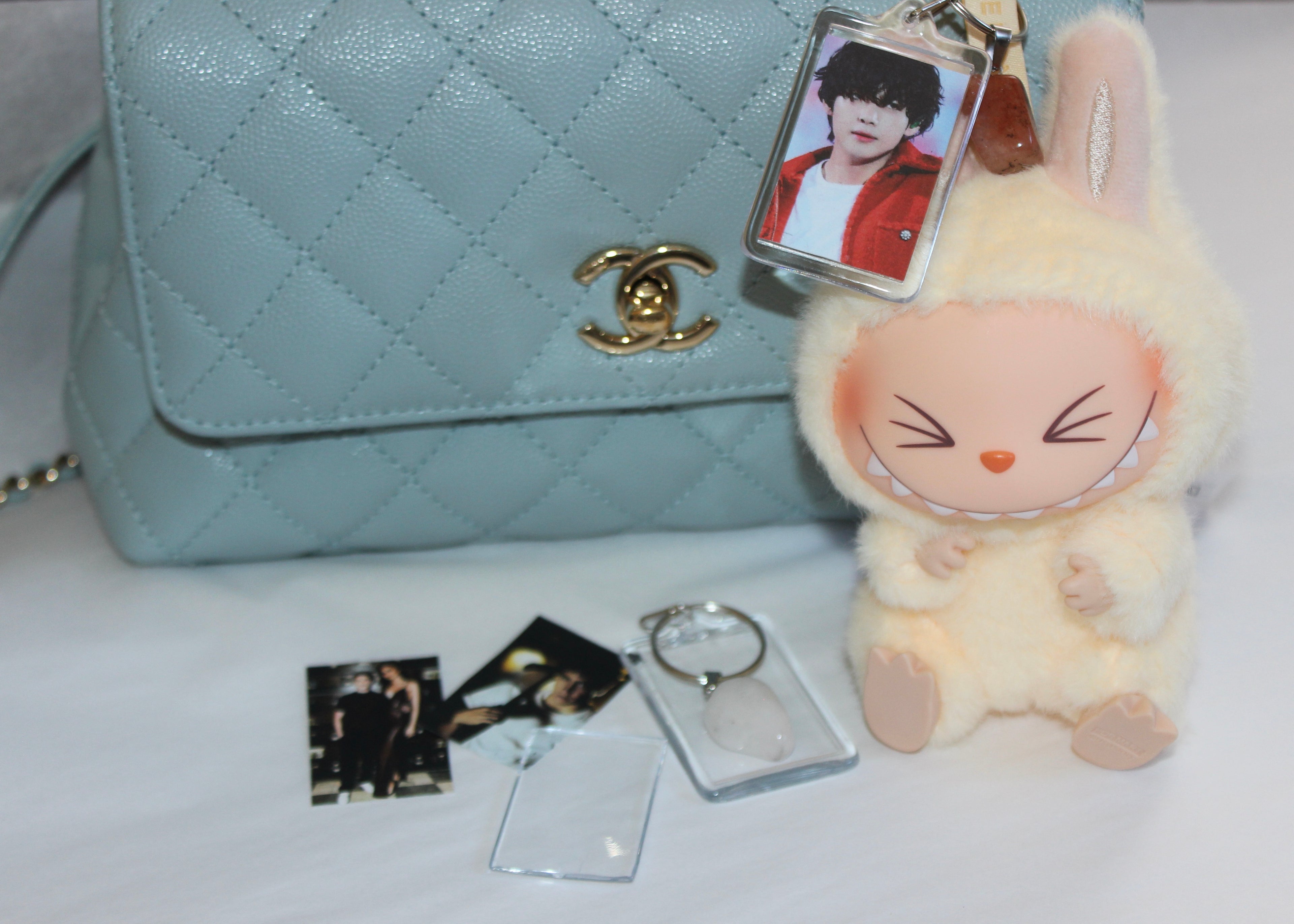 Crystal purse charm keychain featuring healing gemstones like rose quartz and amethyst for well-being.