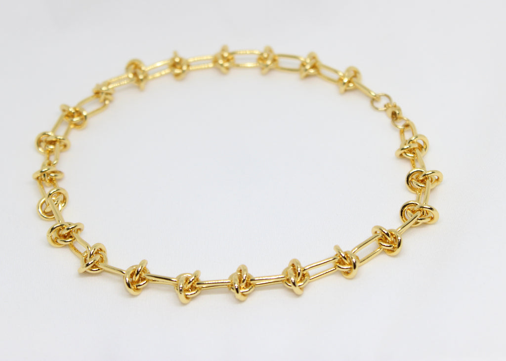 Bold gold barbwire necklace. A modern statement piece symbolizing strength, boundaries, and edgy, fearless style.