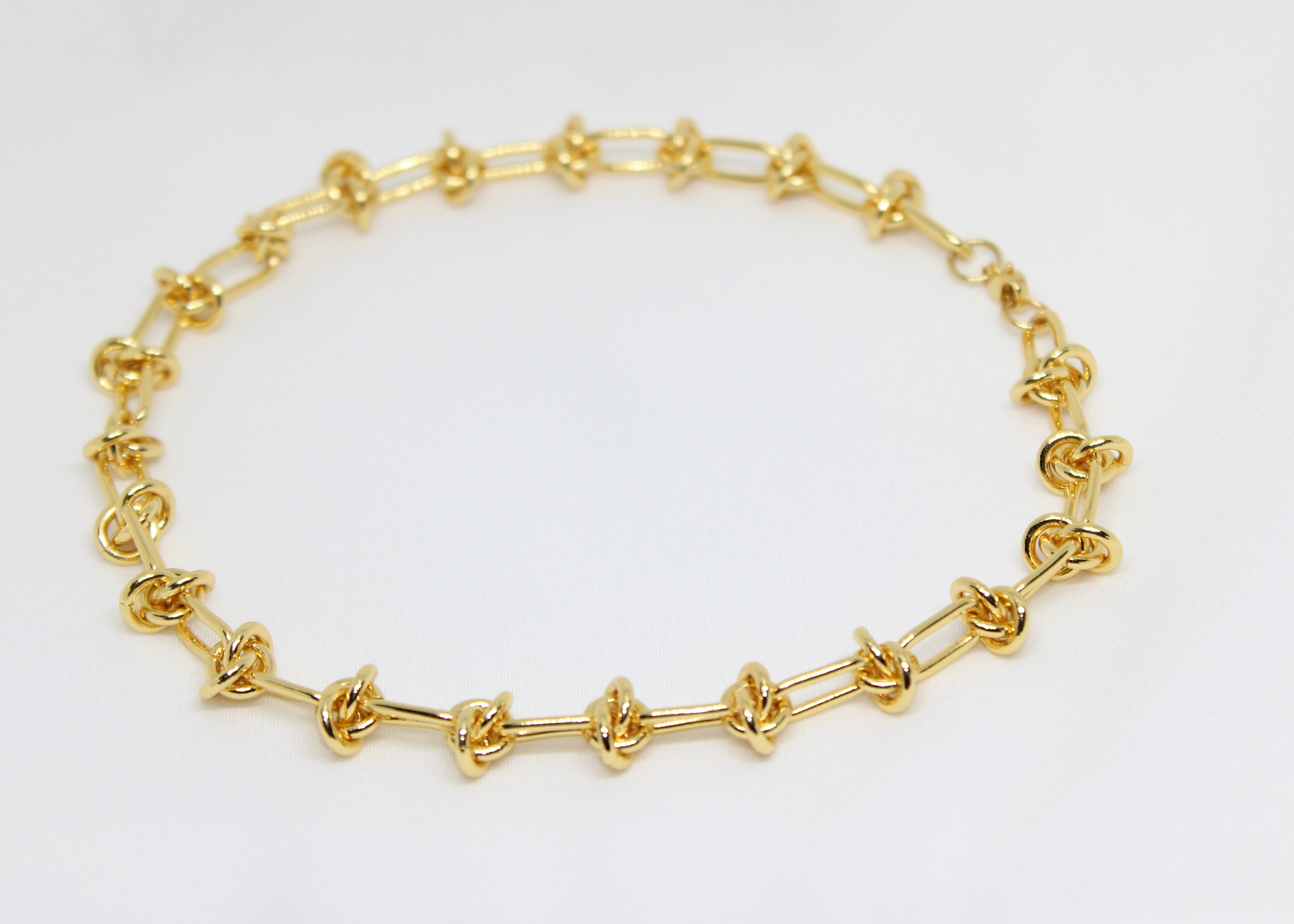 Bold gold barbwire necklace. A modern statement piece symbolizing strength, boundaries, and edgy, fearless style.