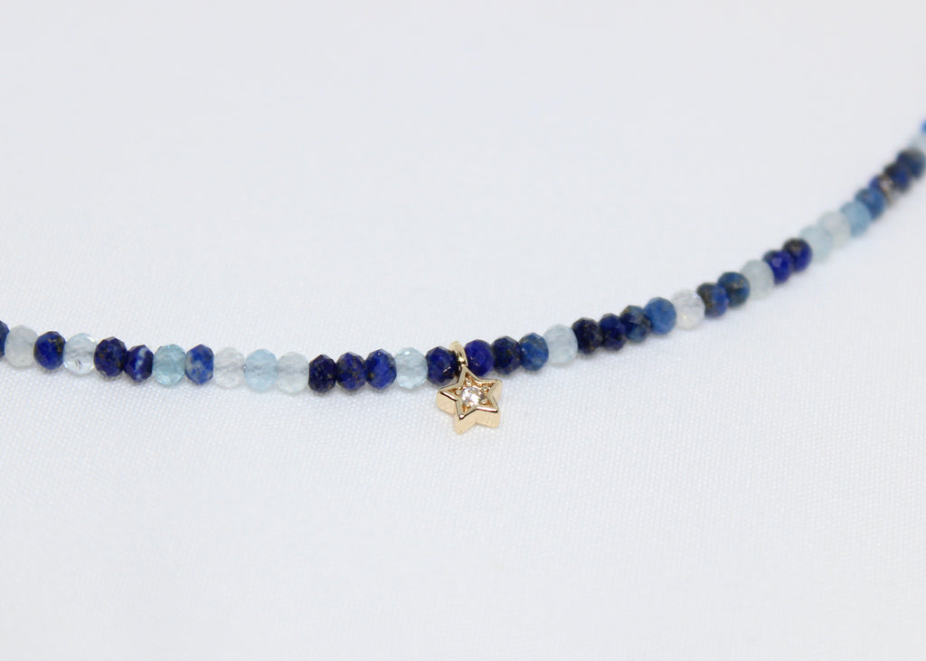 Lapis lazuli and aquamarine necklace with a golden star. Promotes wisdom, peace, and celestial guidance in daily life.