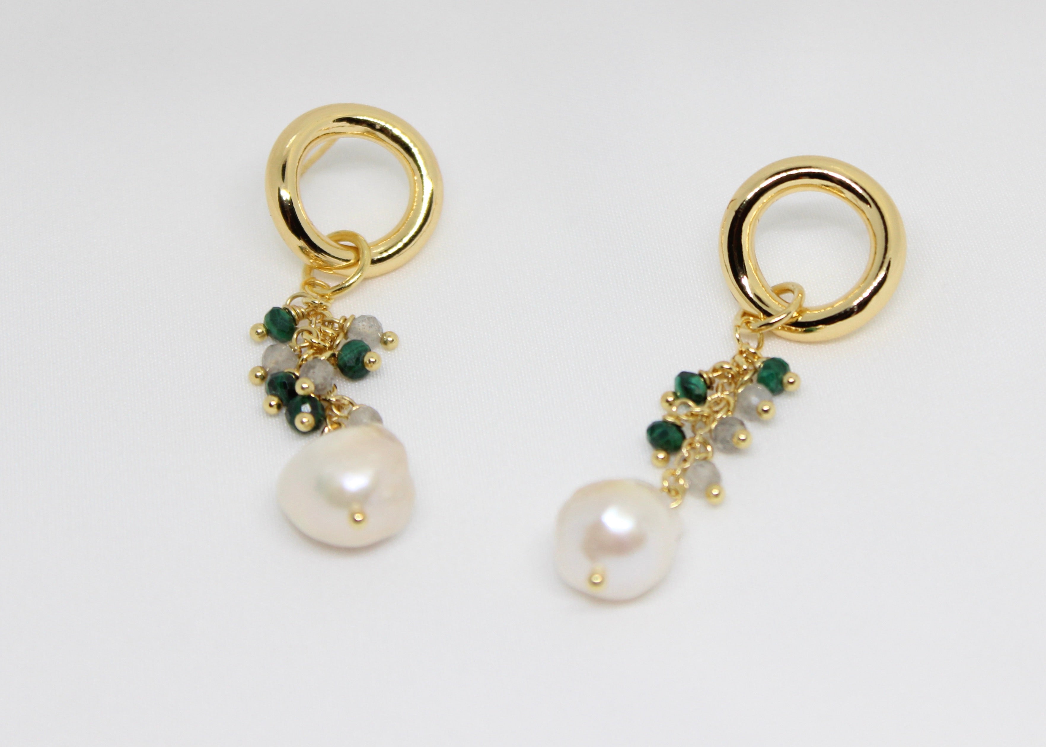 Elegant dangly earrings with clusters of malachite, labradorite beads, and freshwater pearls on gold hoops.