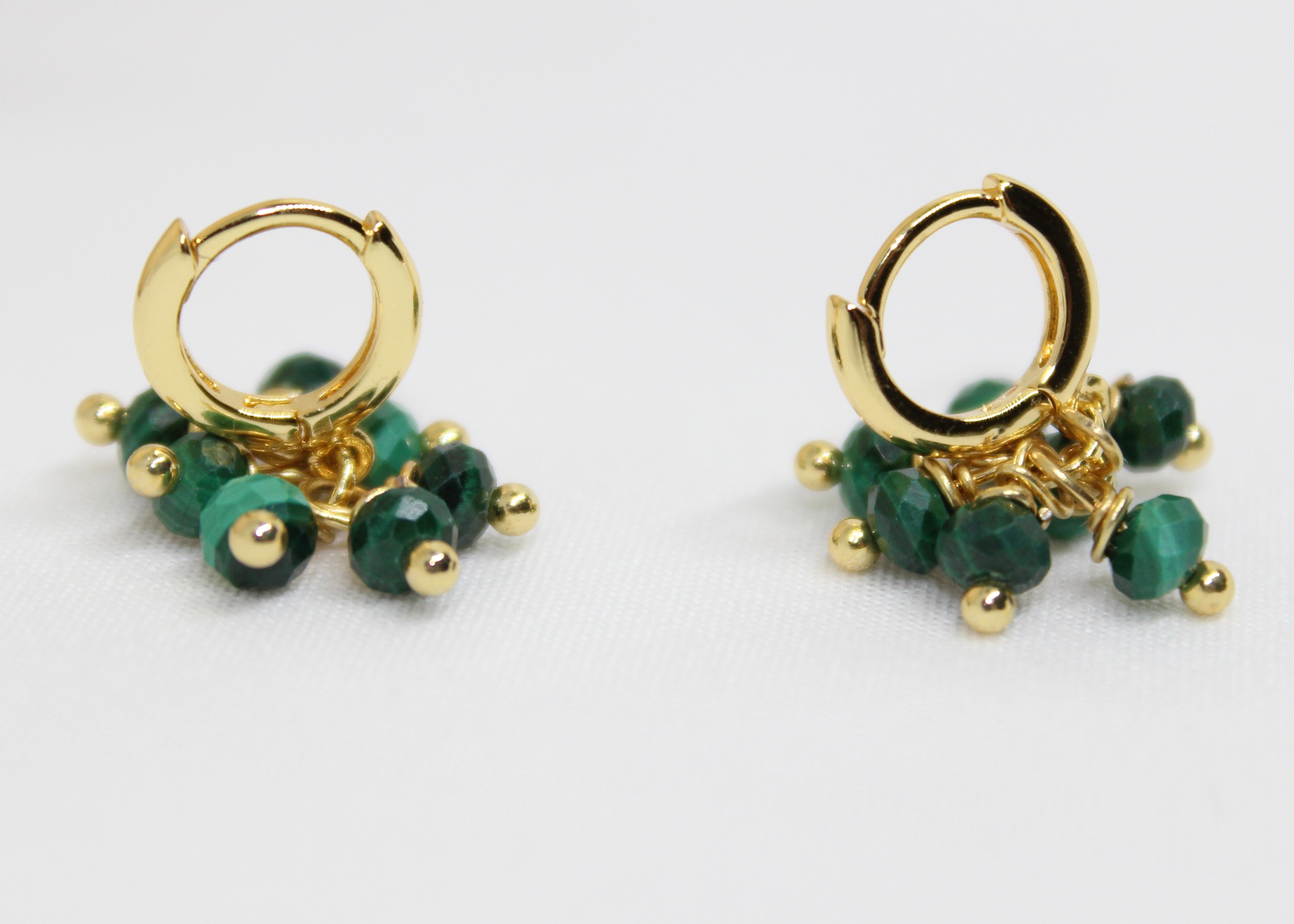 Gold hoop earrings with faceted green malachite beads, non-tarnish hoops for growth and protection.