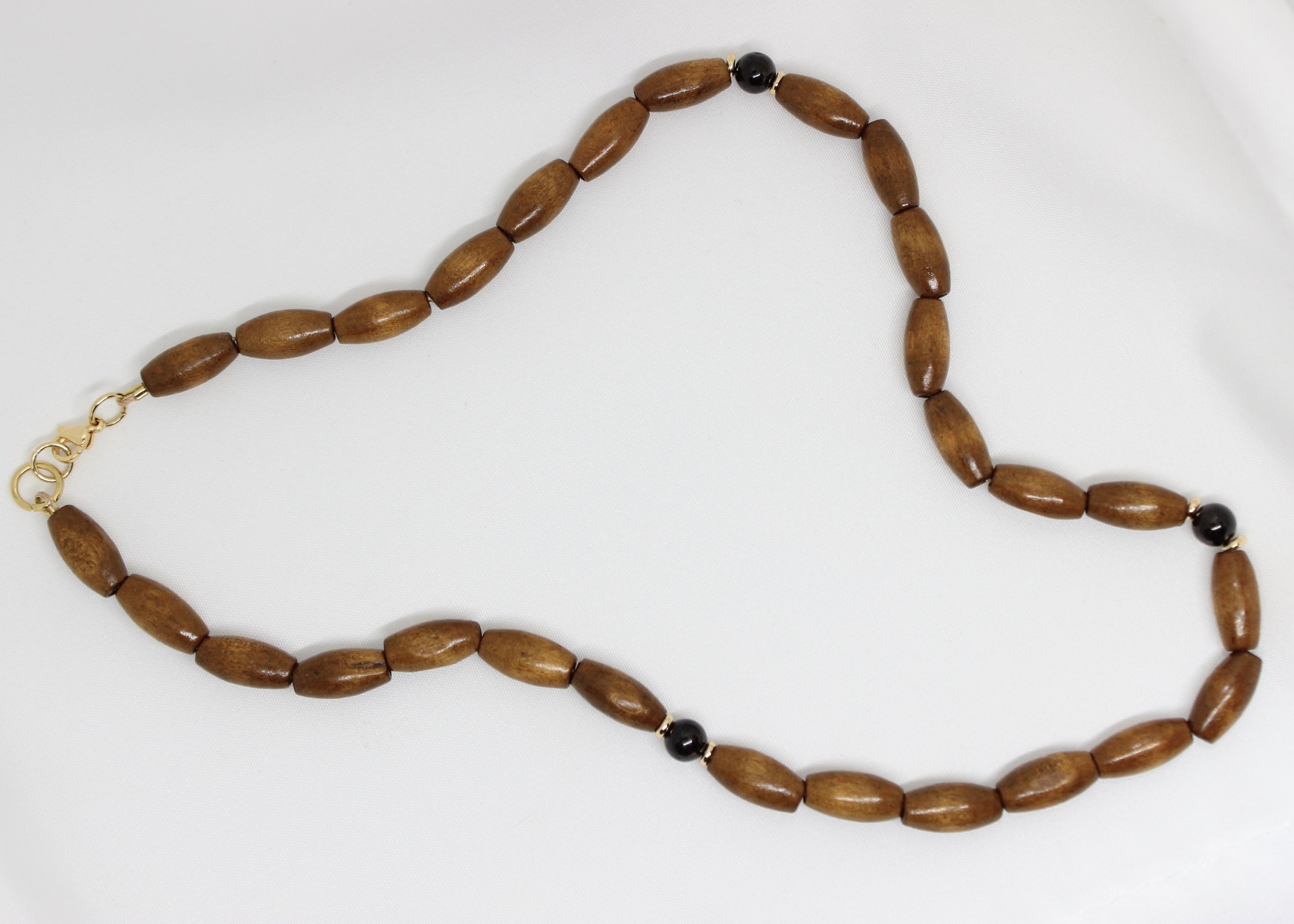 Wood Beaded Necklace with Garnet and Gold Accents – Grounding & Strength