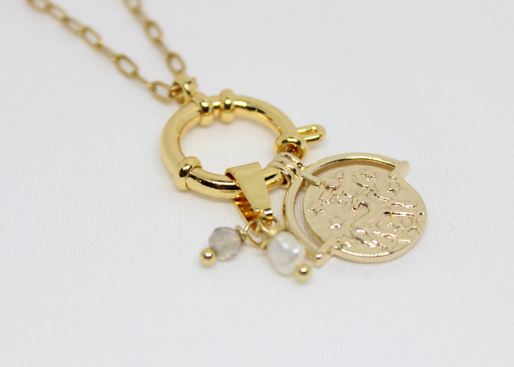 Zodiac coin necklace with pearls and crystals. A celestial talisman for balance, protection, and personal star sign energy.