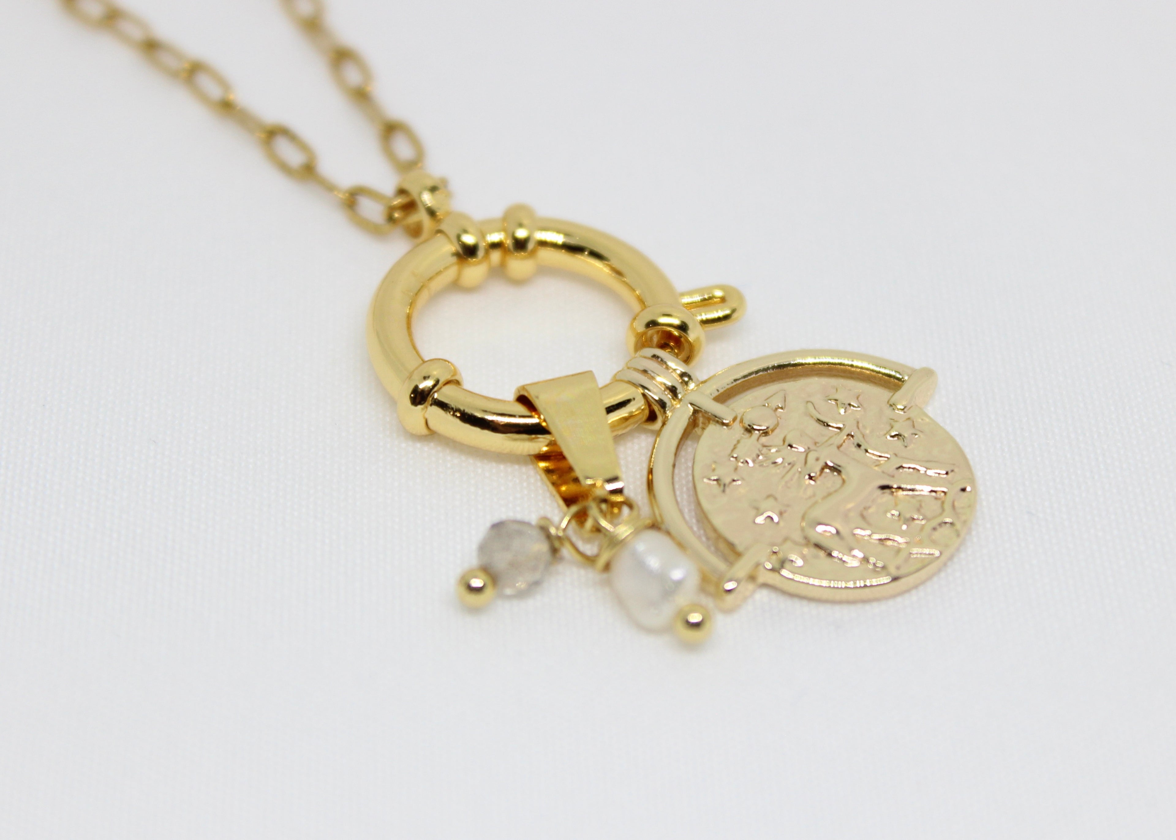 Zodiac coin necklace with pearls and crystals. A celestial talisman for balance, protection, and personal star sign energy.
